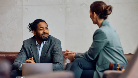 Two People Talking In Office Small